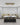 Design studio rendering with a decision counter and wallpaper book display and storage.