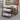 Rendering of display area with shelves and nesting tables containing various pet products in a store setting.